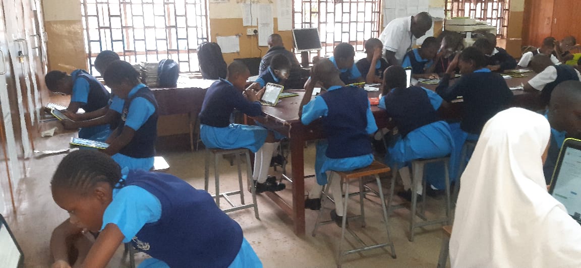 Modern ICT classroom with students using tablets for educational activities